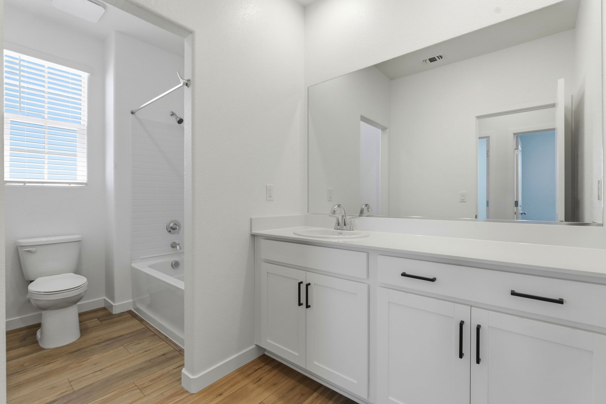 A bathroom with a toilet and sink.