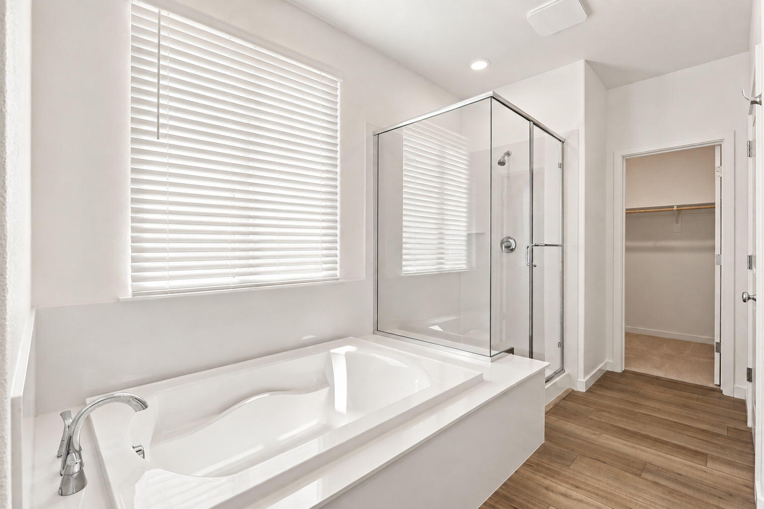 A bathroom with a tub and shower.