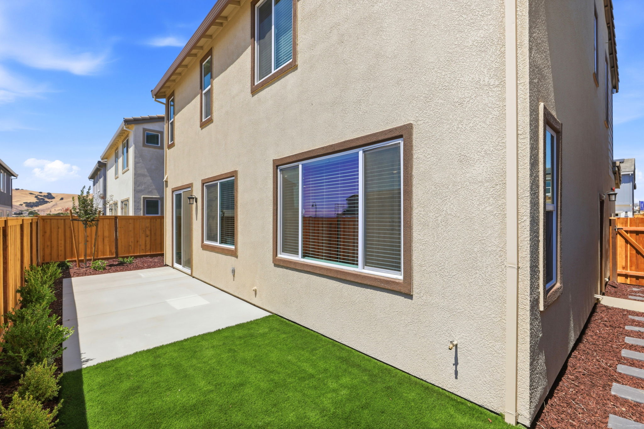 A house with a green lawn.