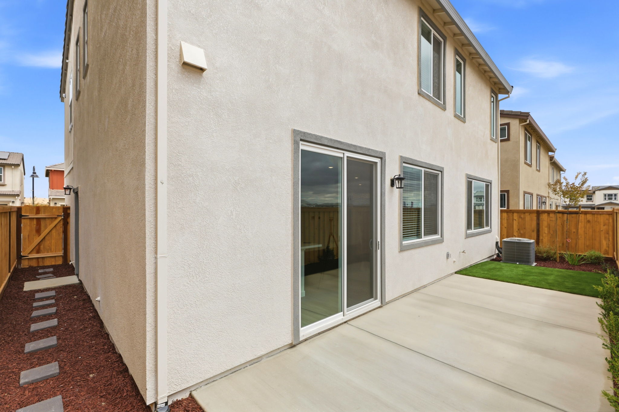 A white building with a glass door.