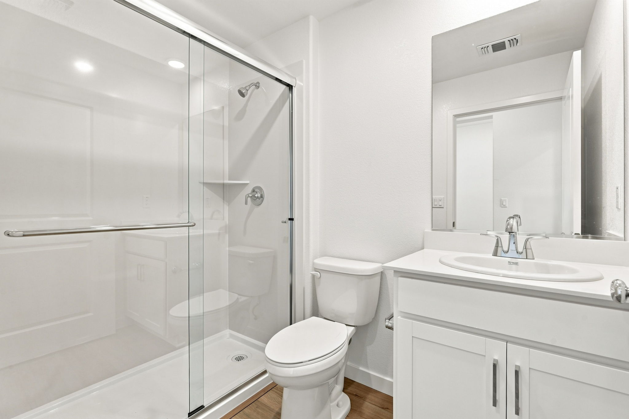 A bathroom with a glass shower.