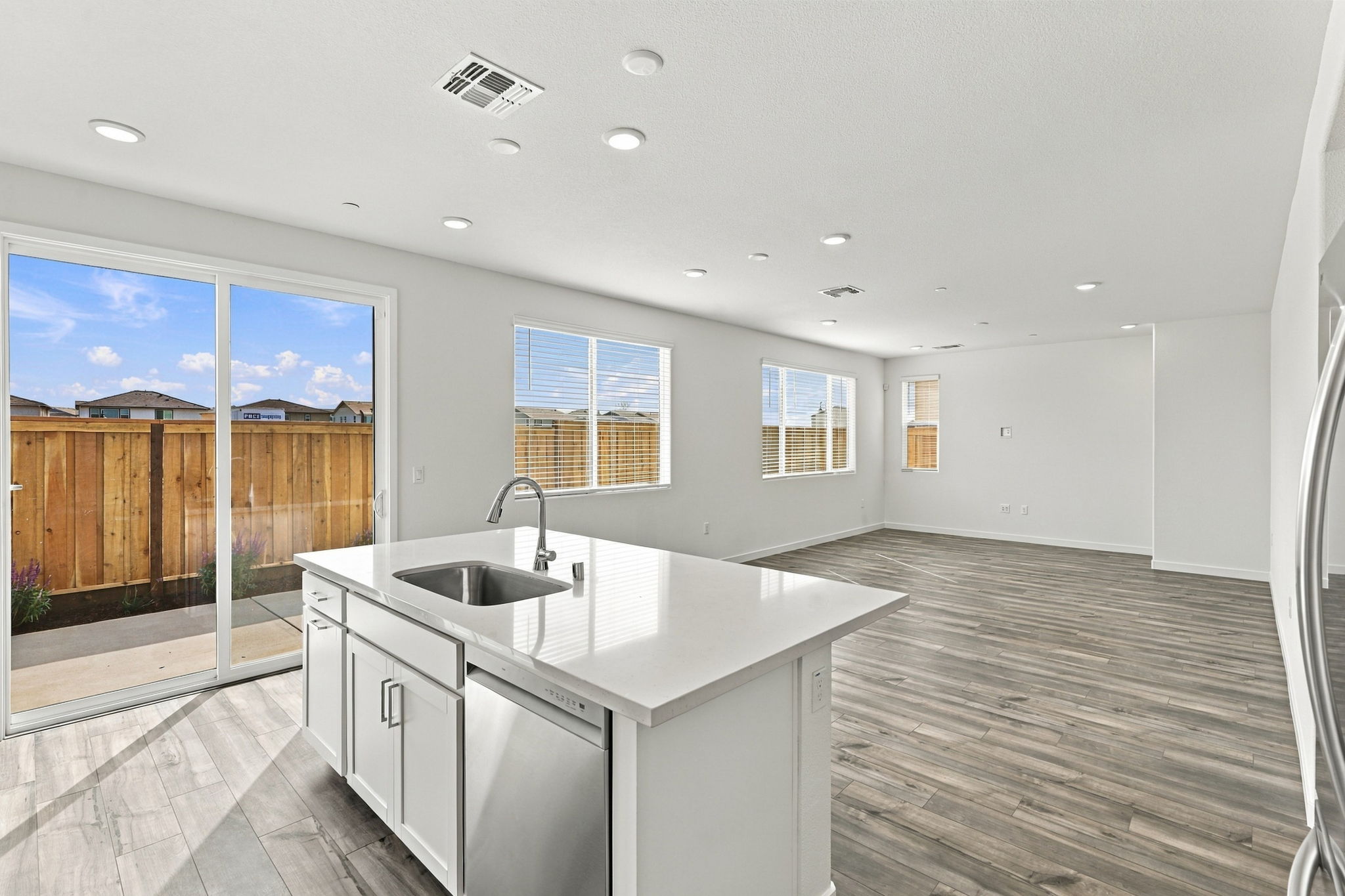 A kitchen with a large window.