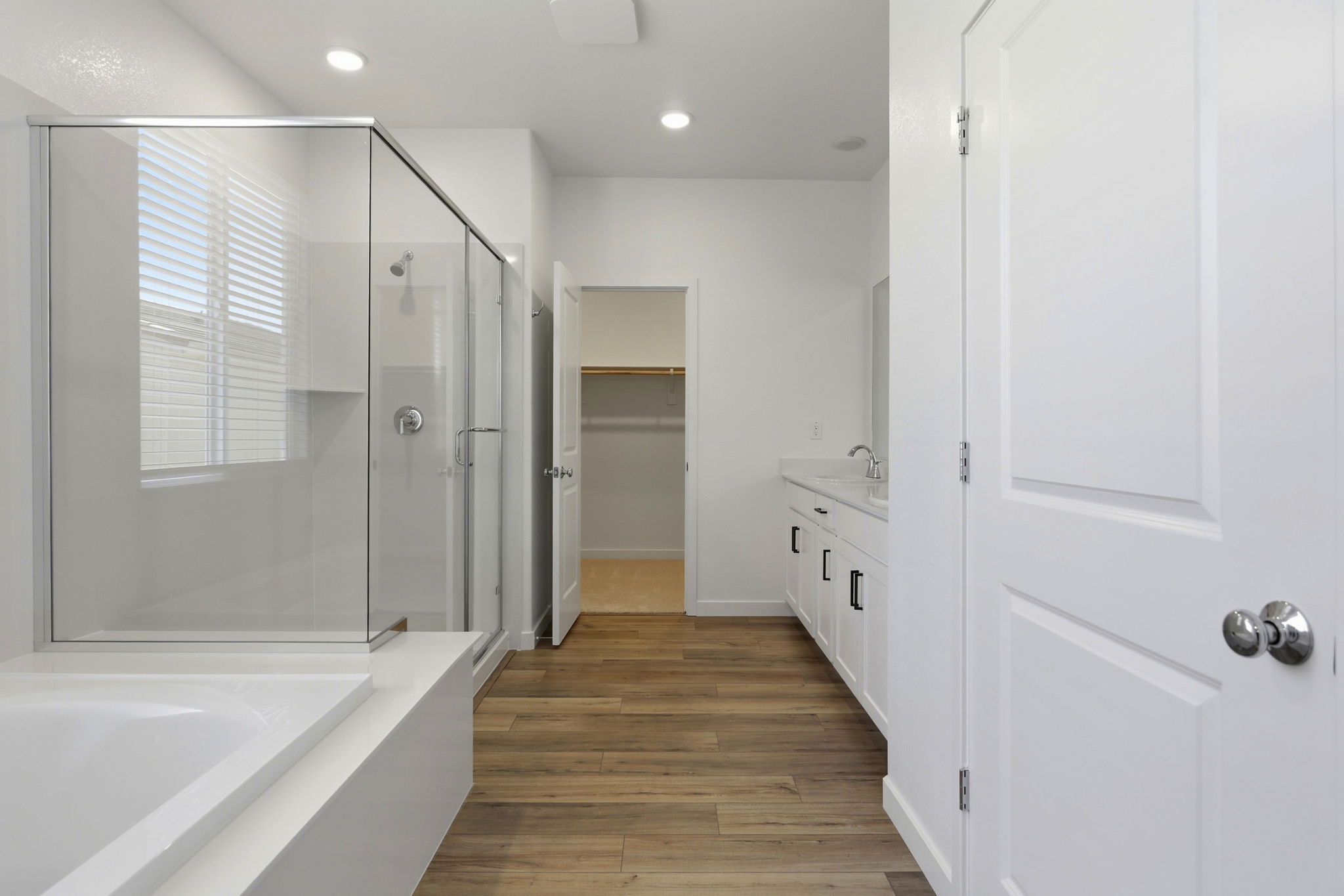 A bathroom with a tub and shower.