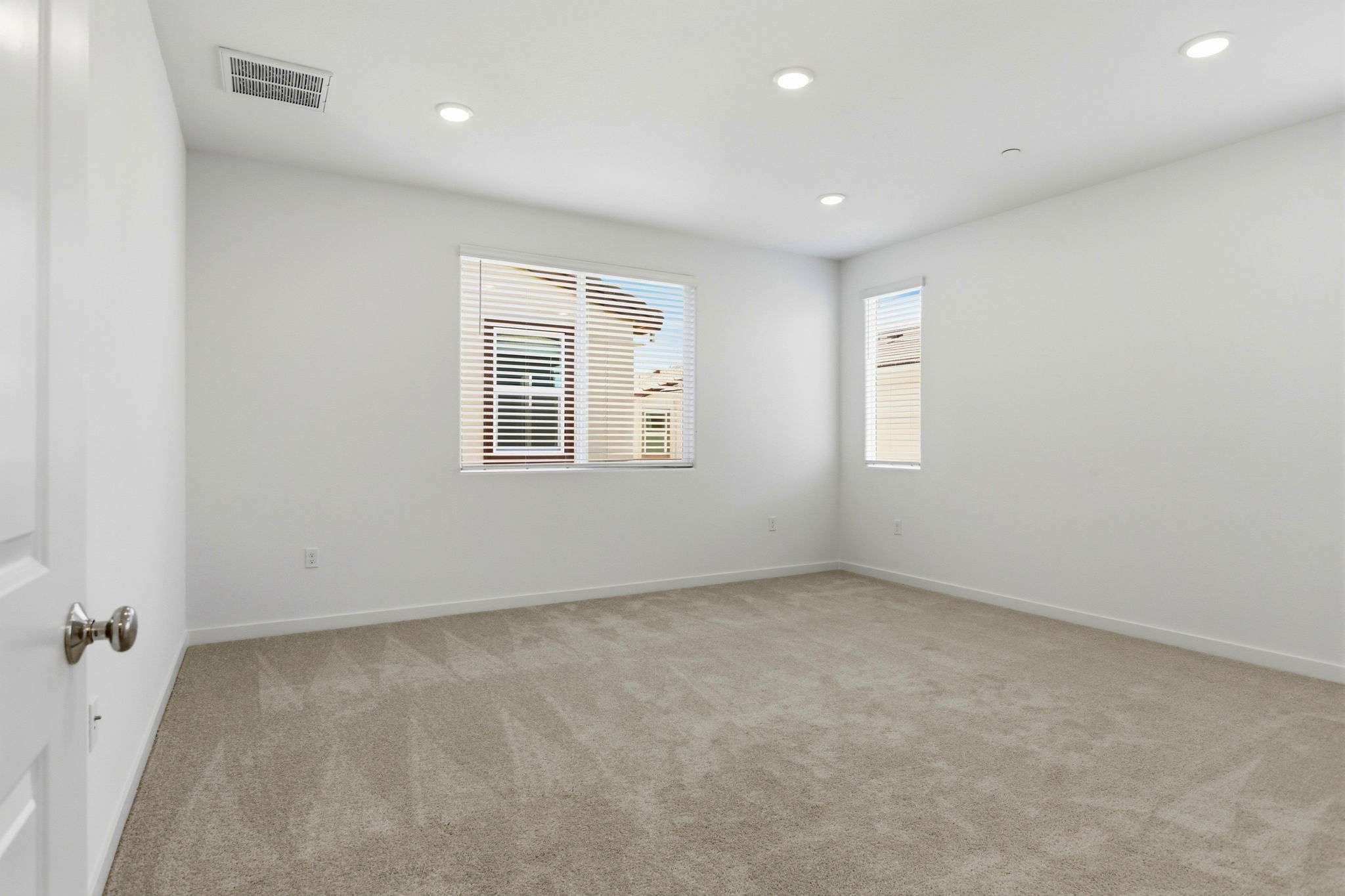 A room with a door and a window.