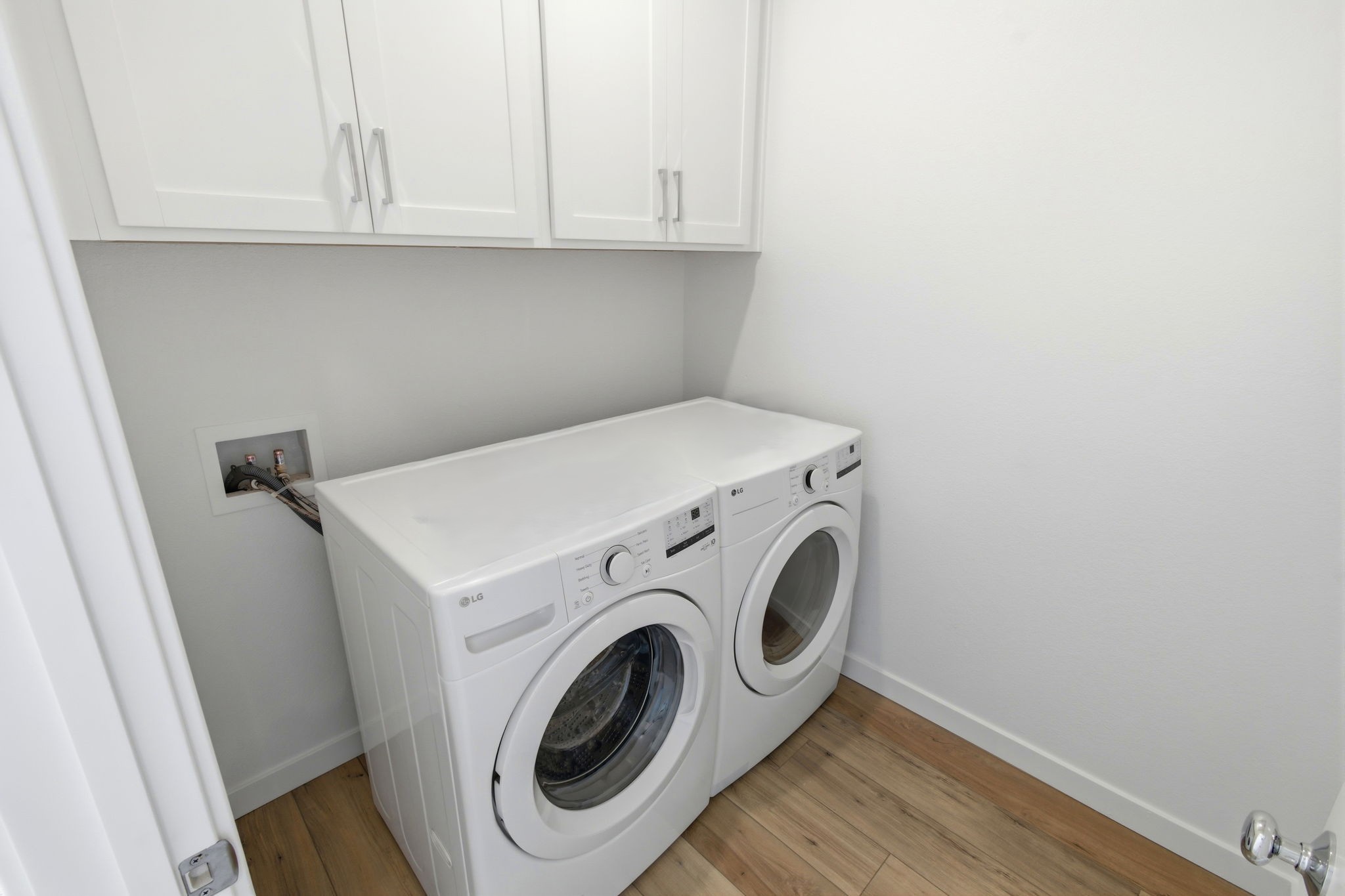 A white washing machine in a room.