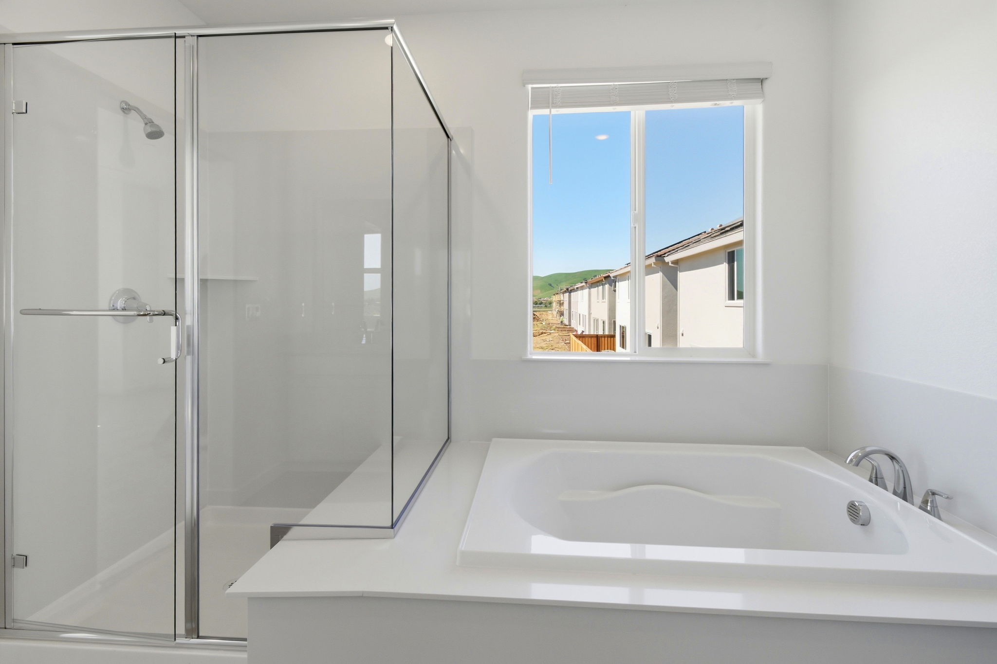 A bathroom with a glass shower.