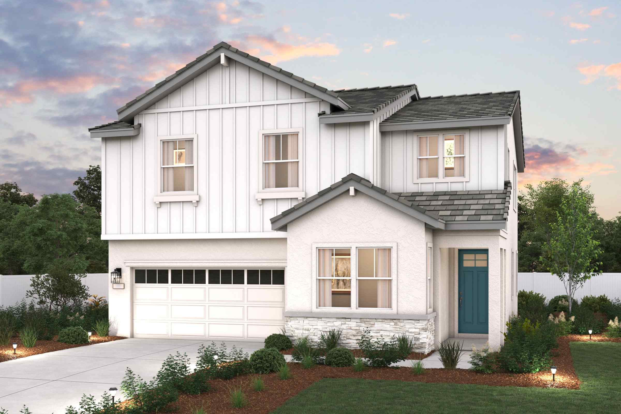 A white house with a garage.