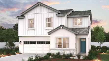 A white house with a garage.