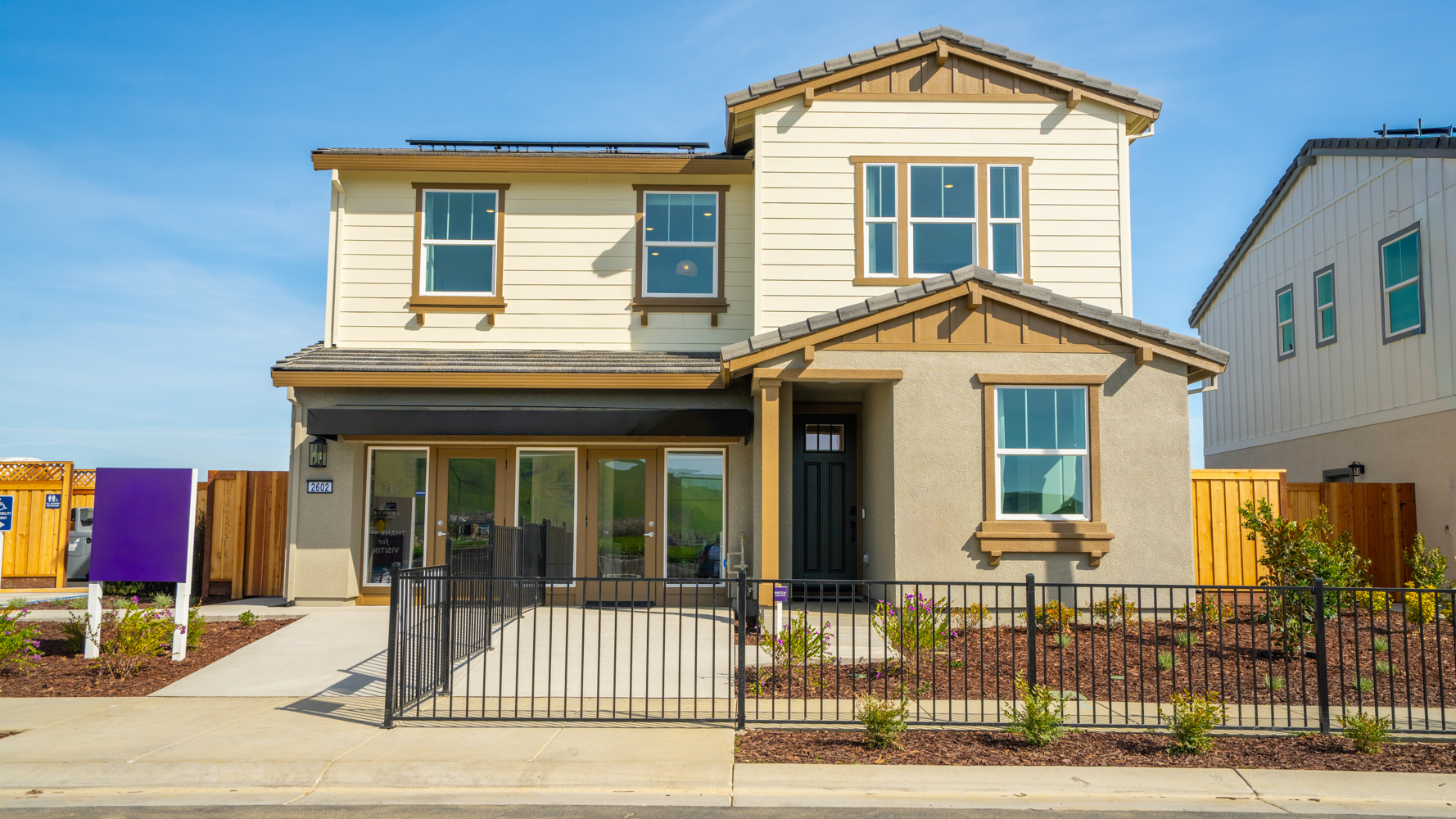 A house with a black fence.
