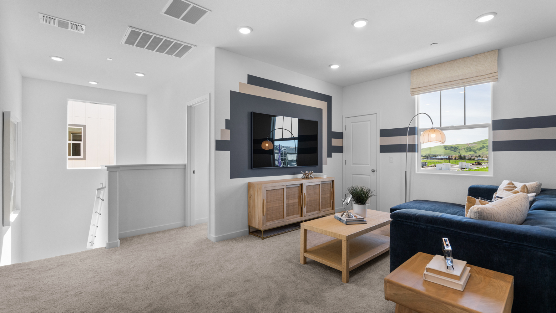 A living room with a tv and couches.