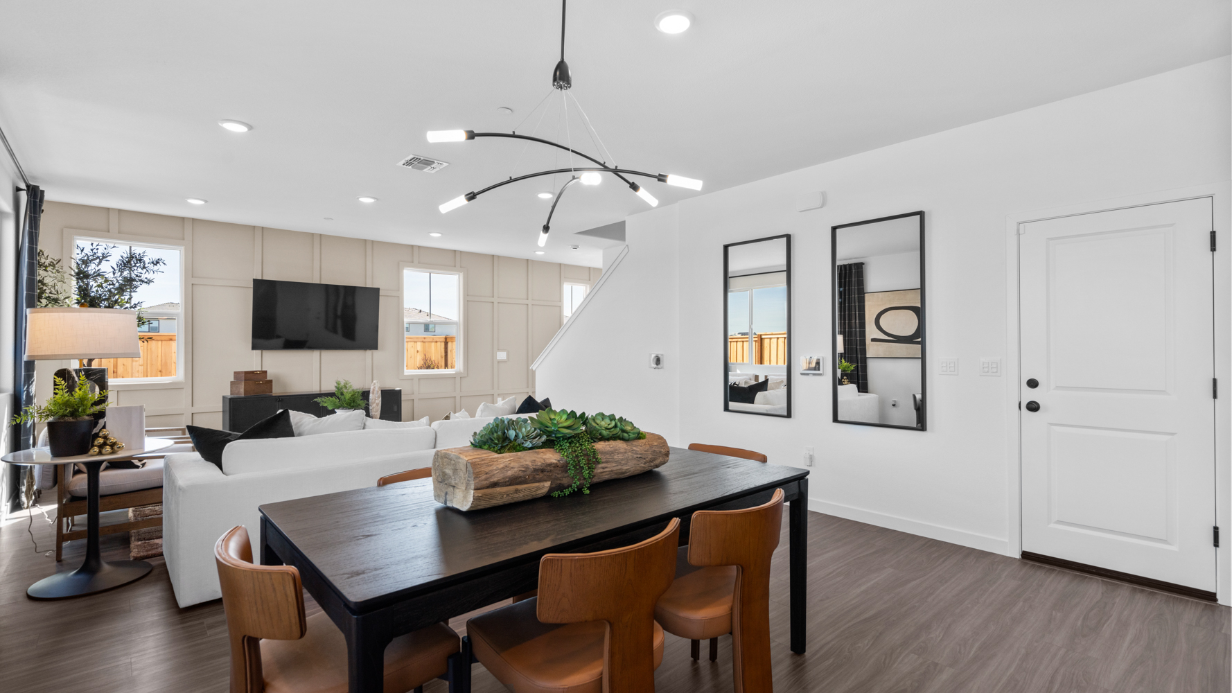 A room with a table and chairs.