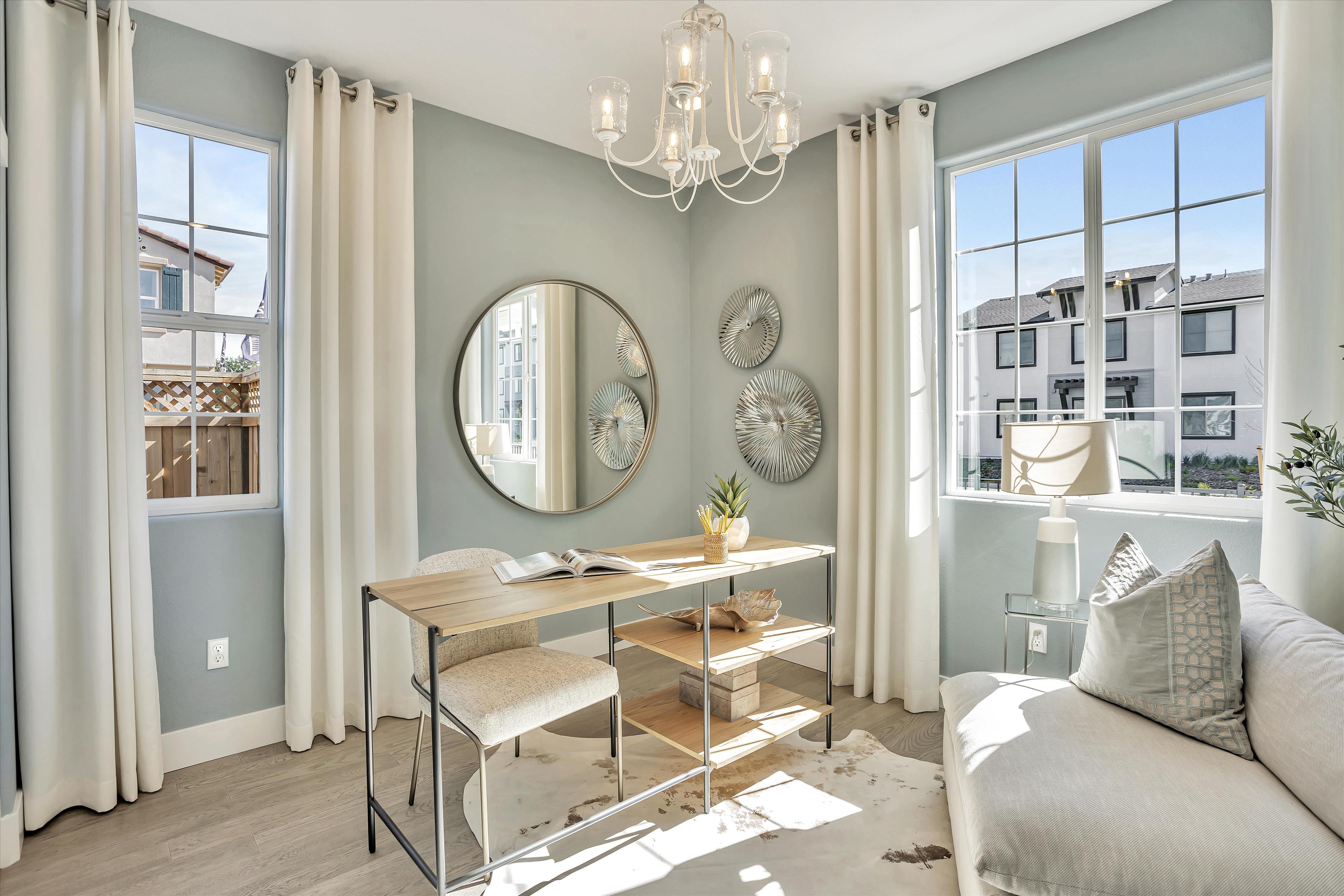 A room with a table and chairs.