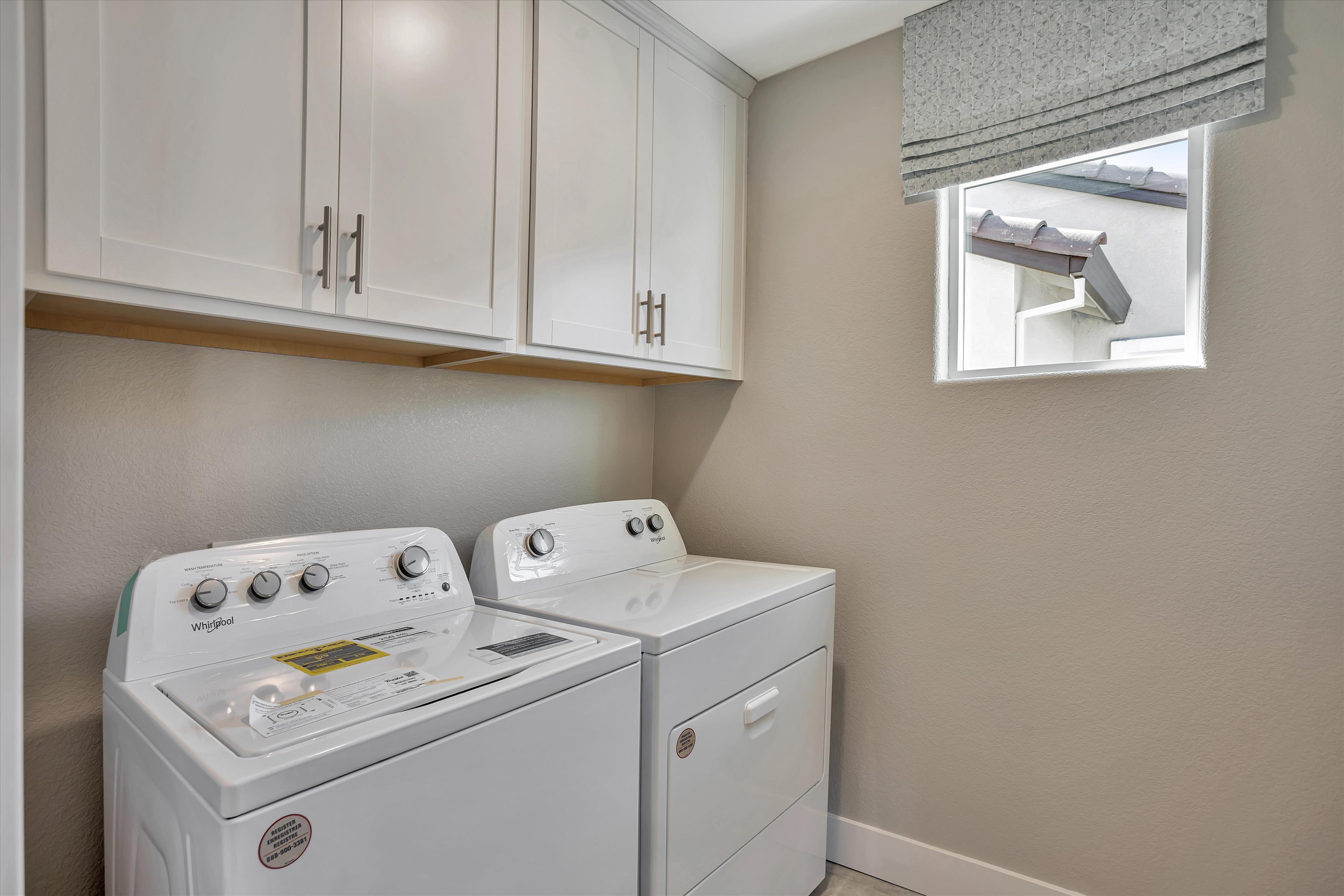 A washing machine in a kitchen.