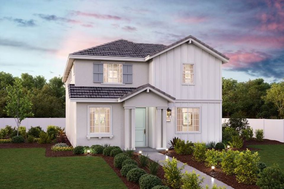 A house with a large front yard.