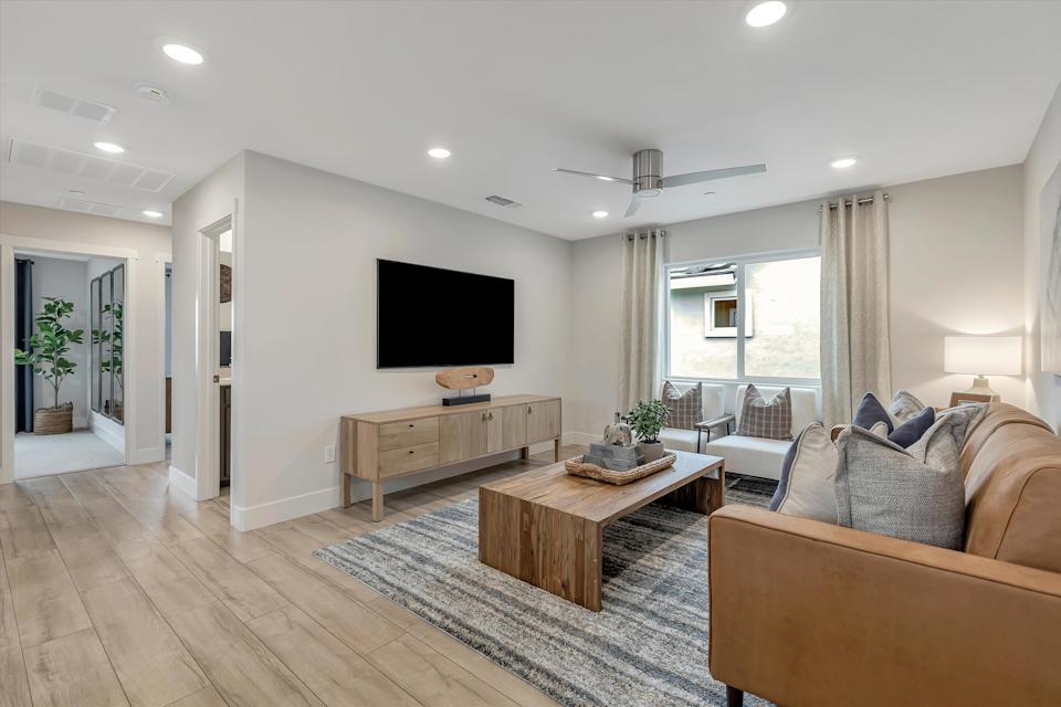 A living room with a tv and couches.