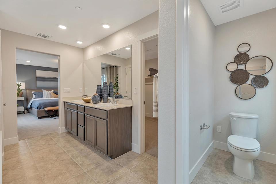 A bathroom with a toilet and sink.