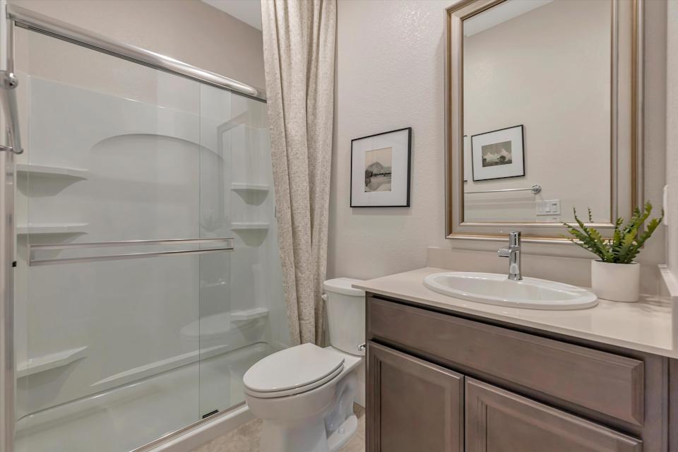 A bathroom with a glass shower.