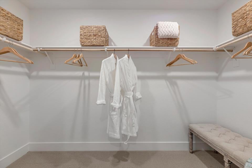 A white towel on a white rack.