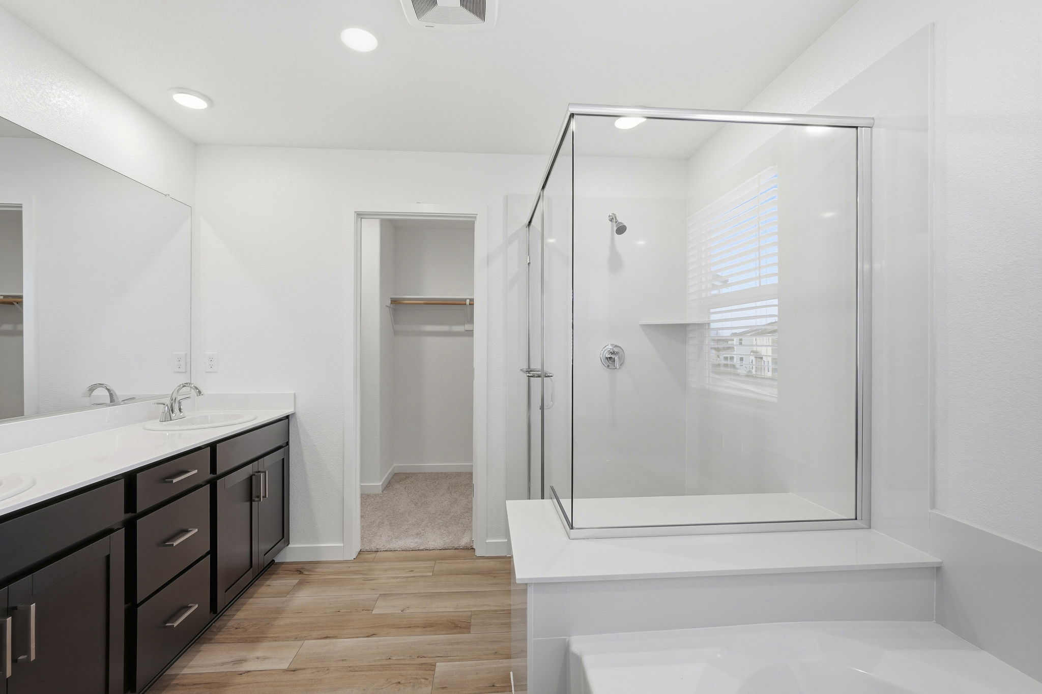 A bathroom with a glass shower.