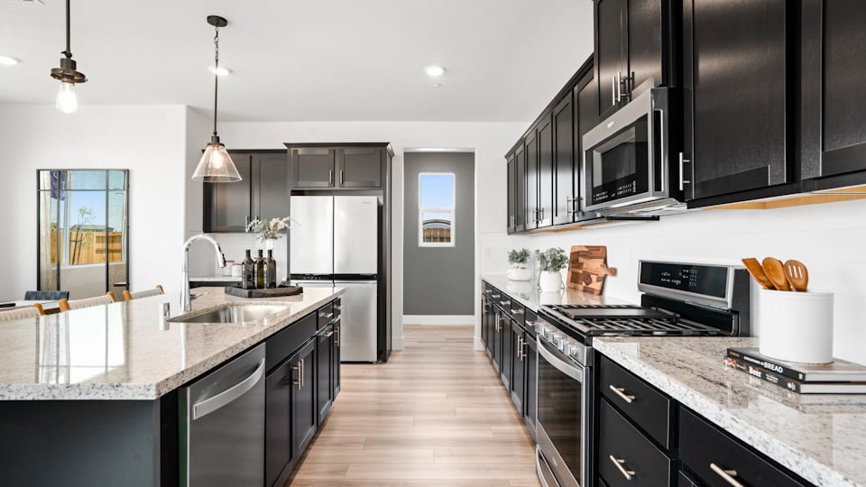 A kitchen with black appliances.