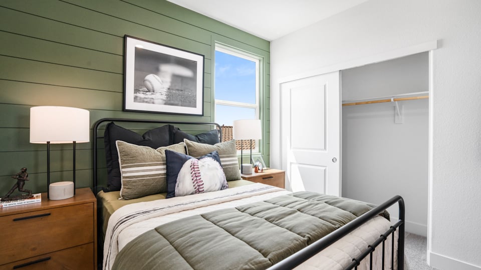 A bed with a blanket on it.