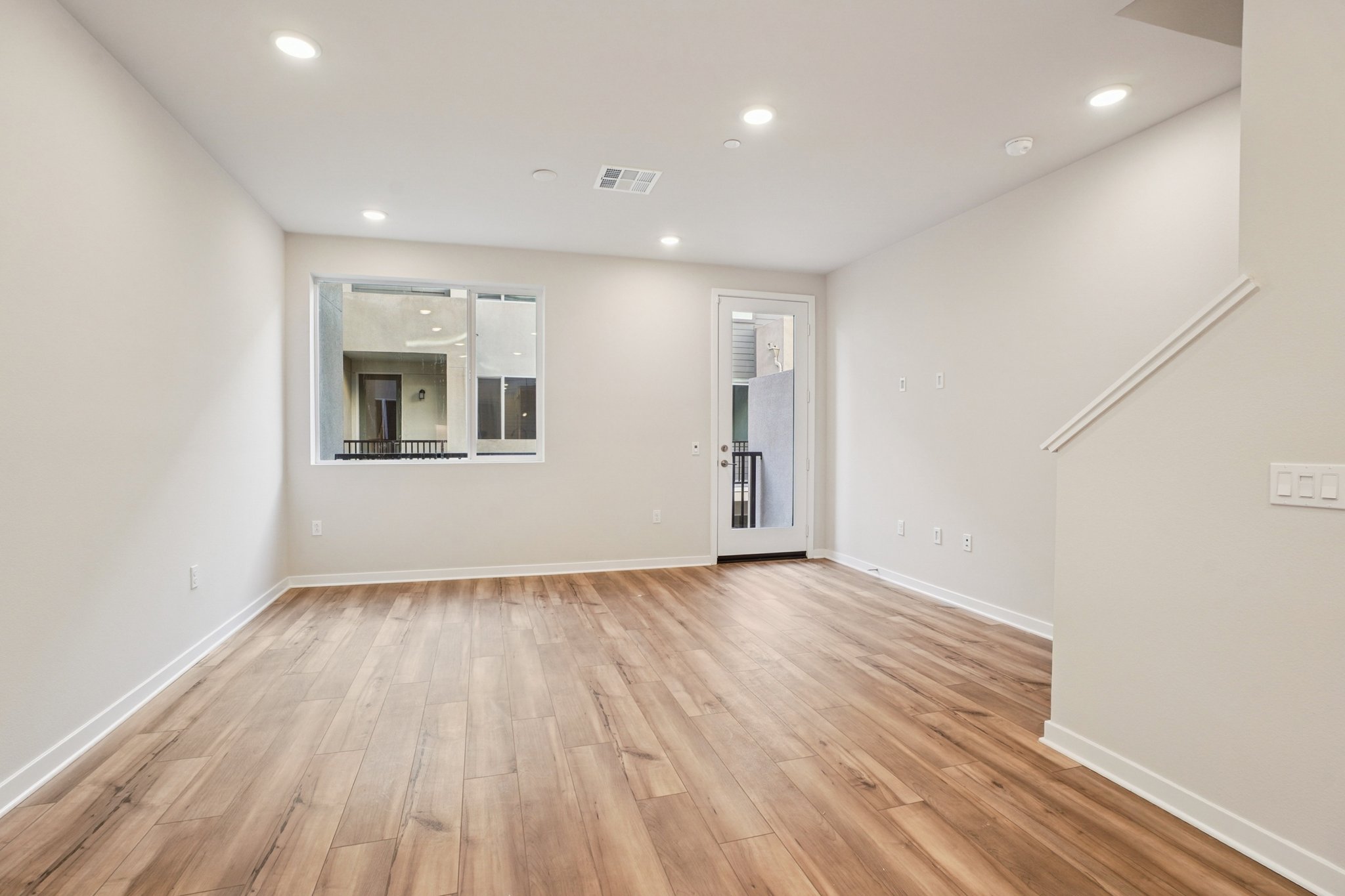A room with a wood floor and a wood floor.