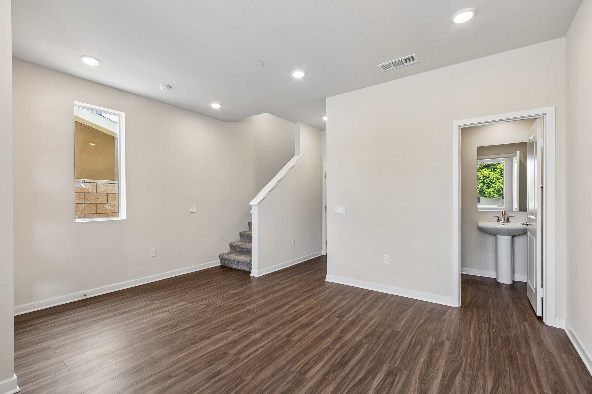 A bathroom with a wood floor.