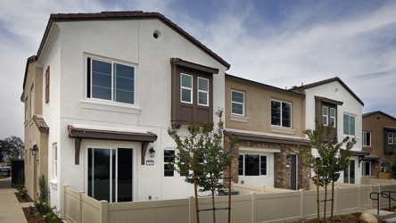 A white house with a fence.