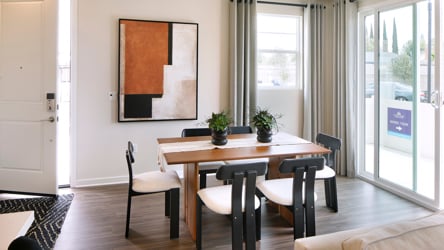 A room with a table and chairs.