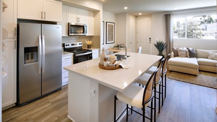 A kitchen with a dining table.