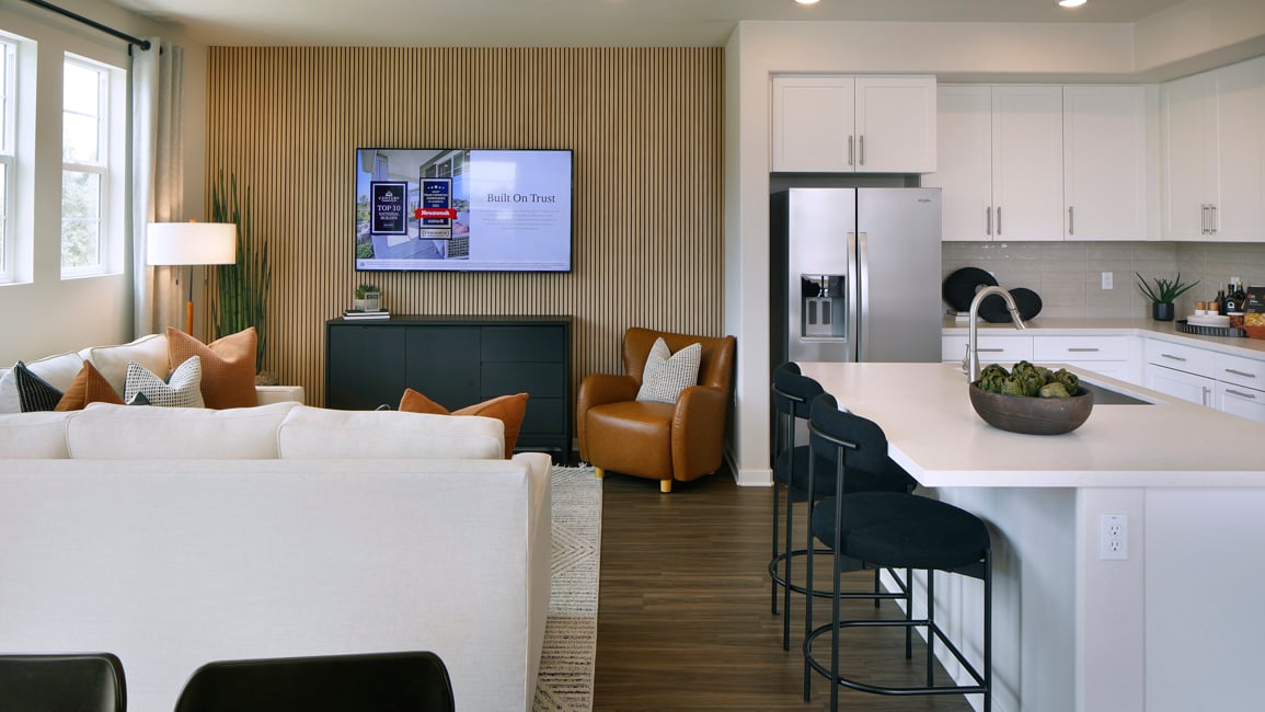 A living room with a tv and couches.