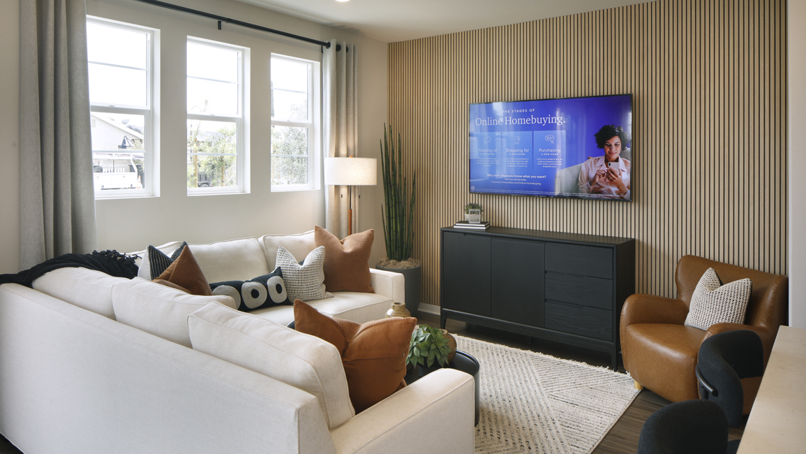 A living room with a tv and couches.