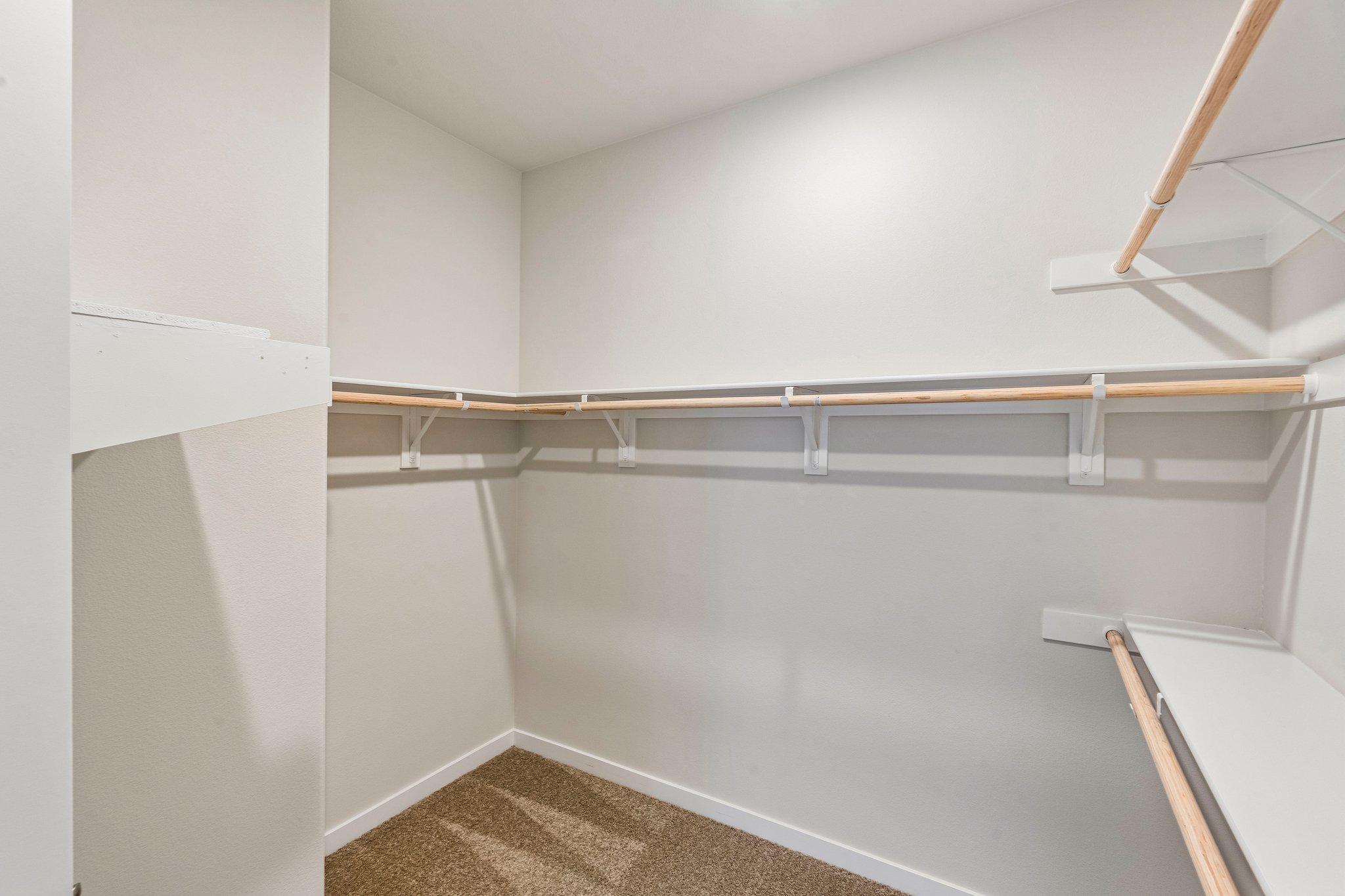 A white room with a metal railing.
