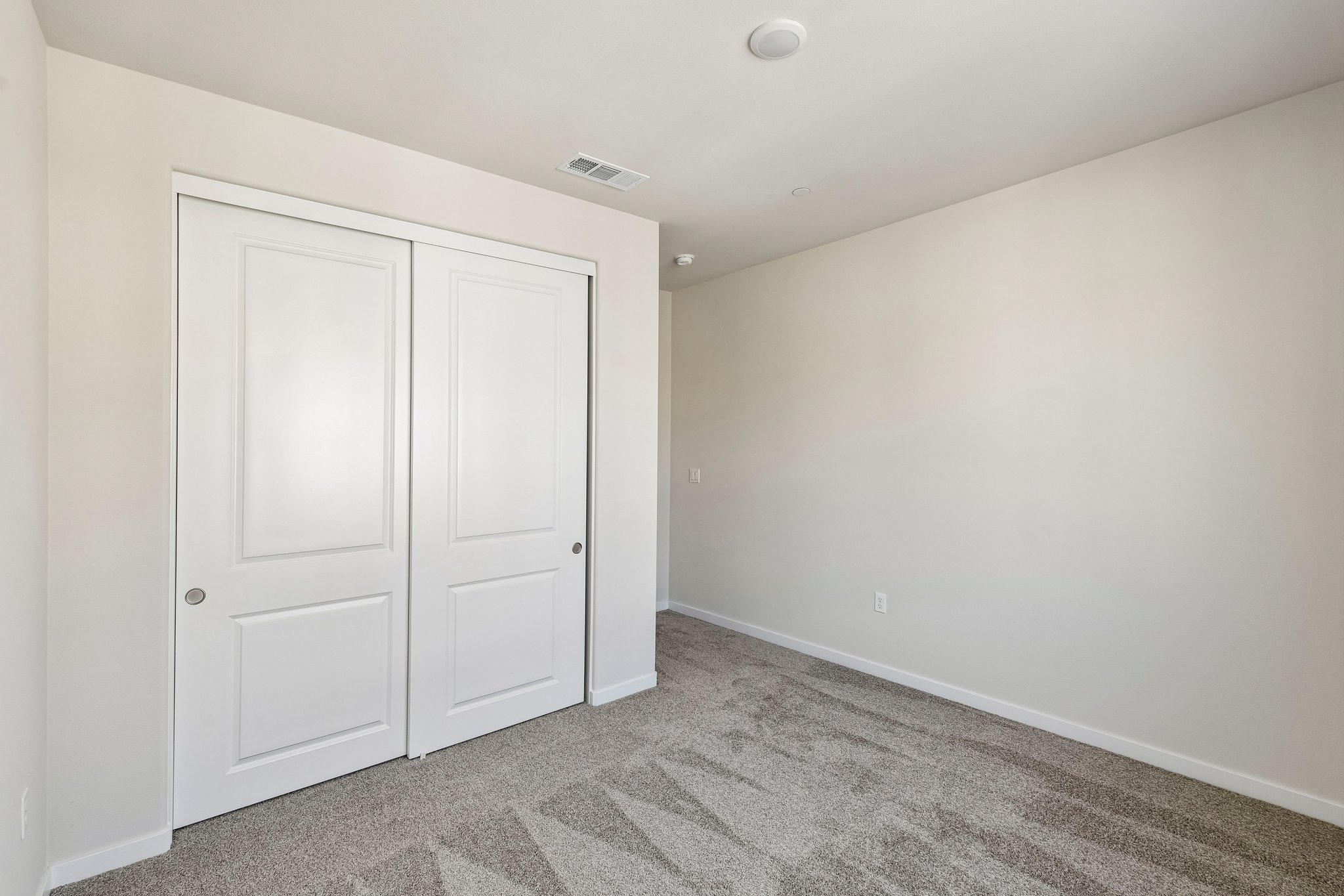 A room with white doors.