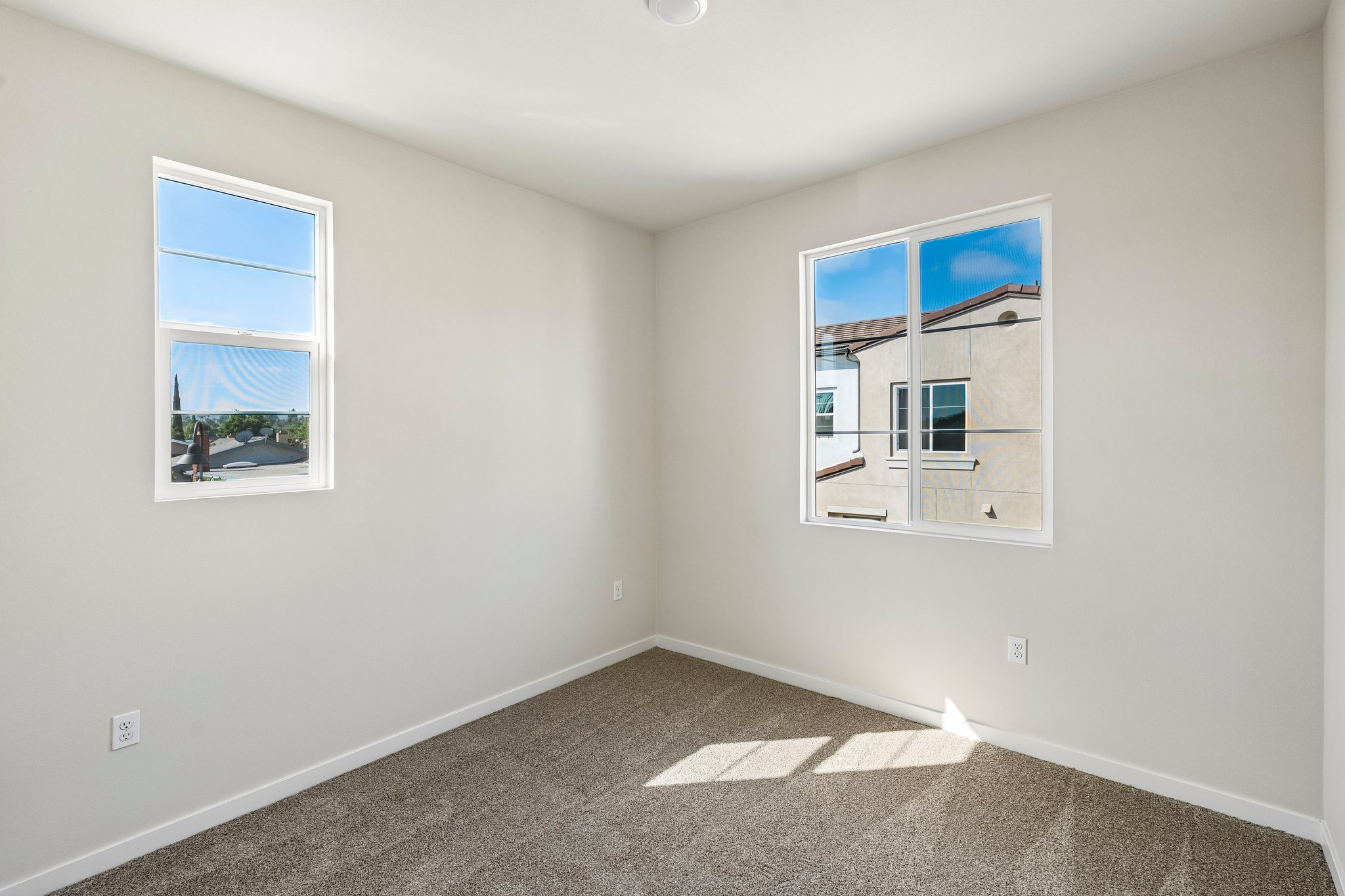 A room with a couple of windows.