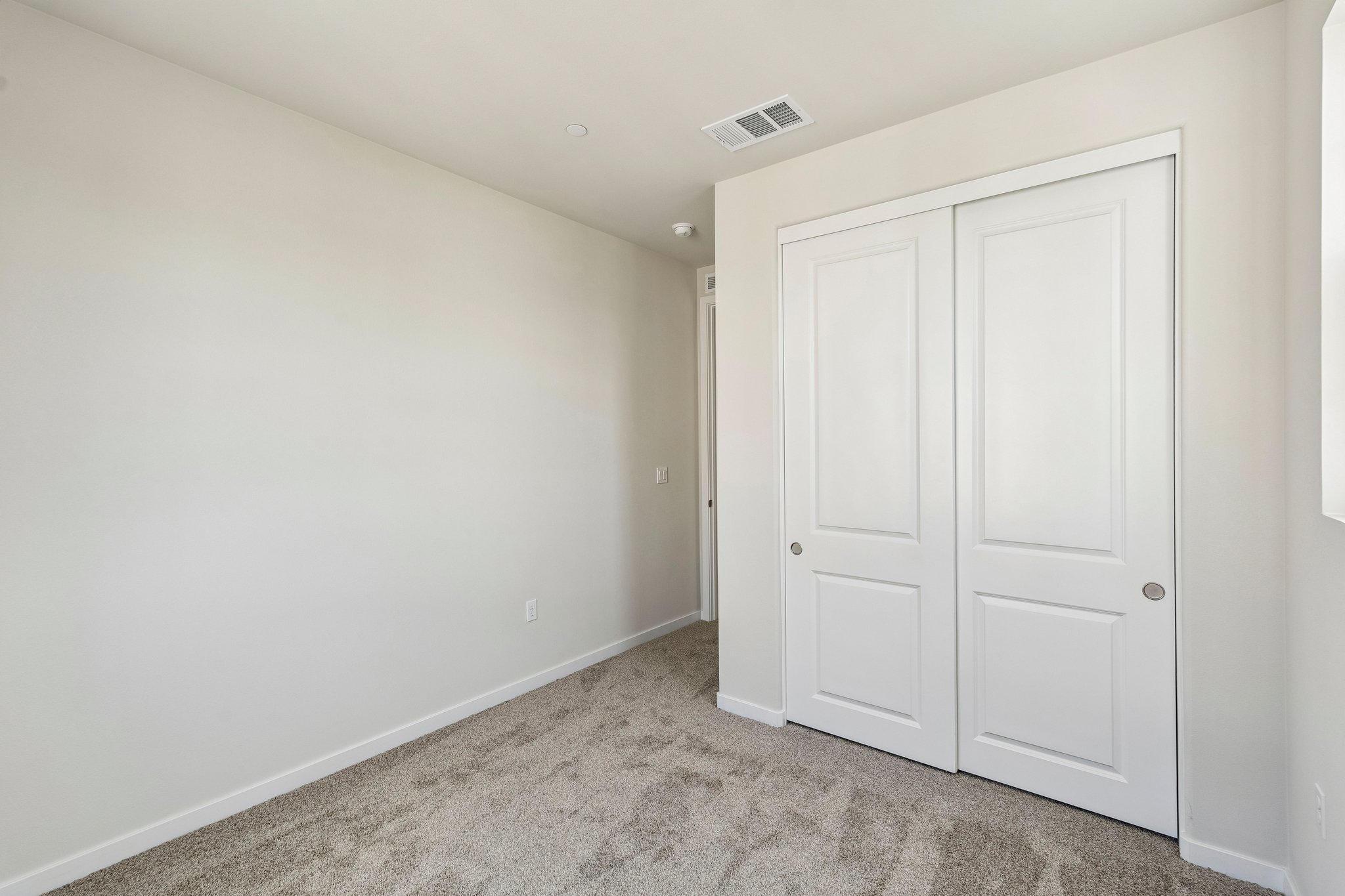 A room with white doors.