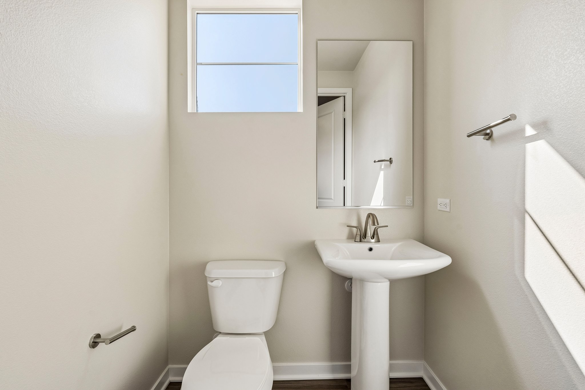 A bathroom with a sink and toilet.