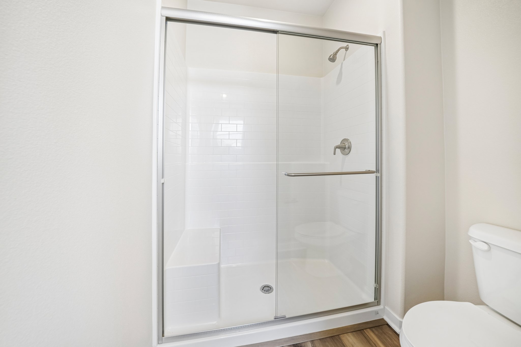 A shower unit in a bathroom.