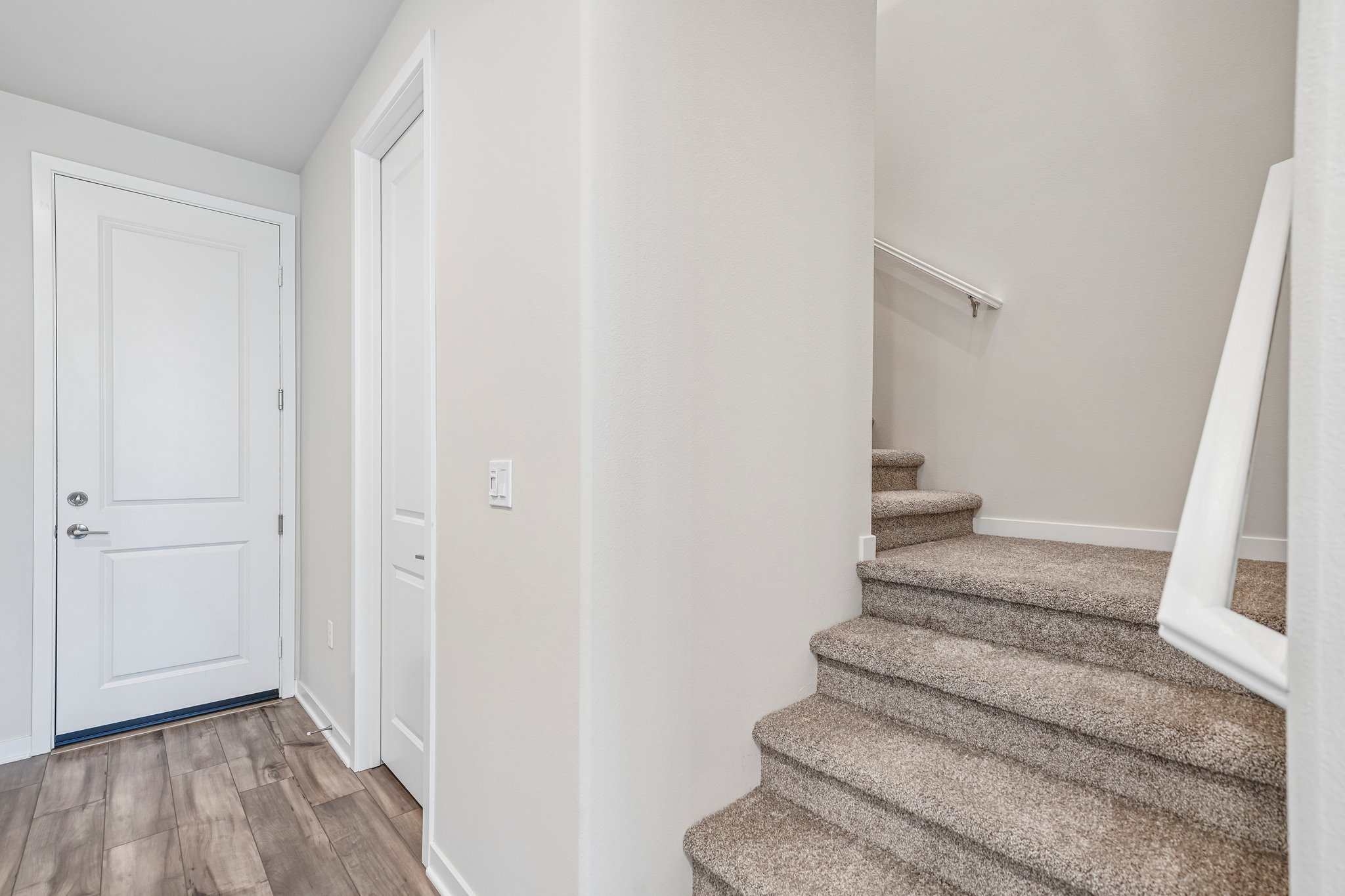 A hallway with white doors.