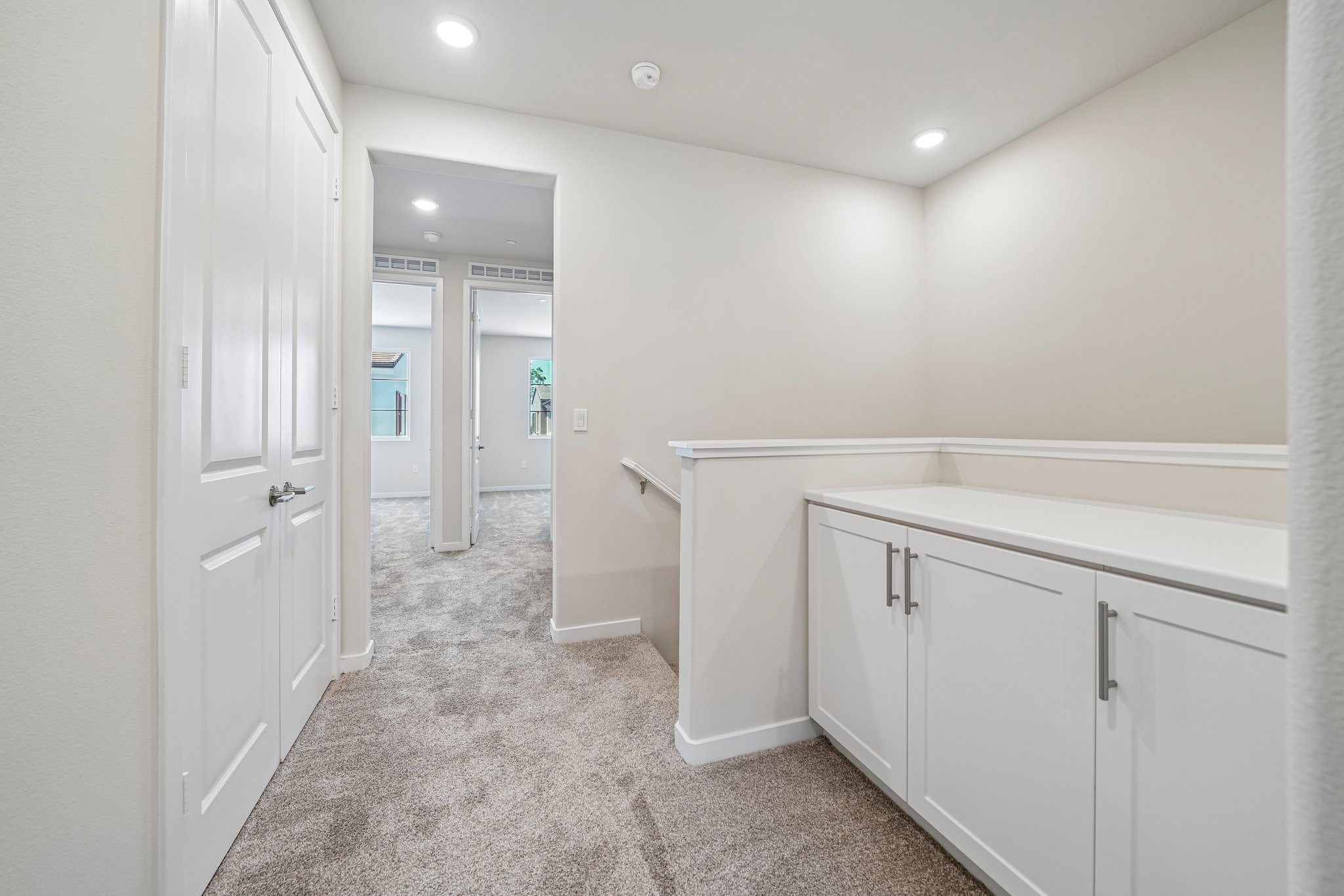 A room with white cabinets.