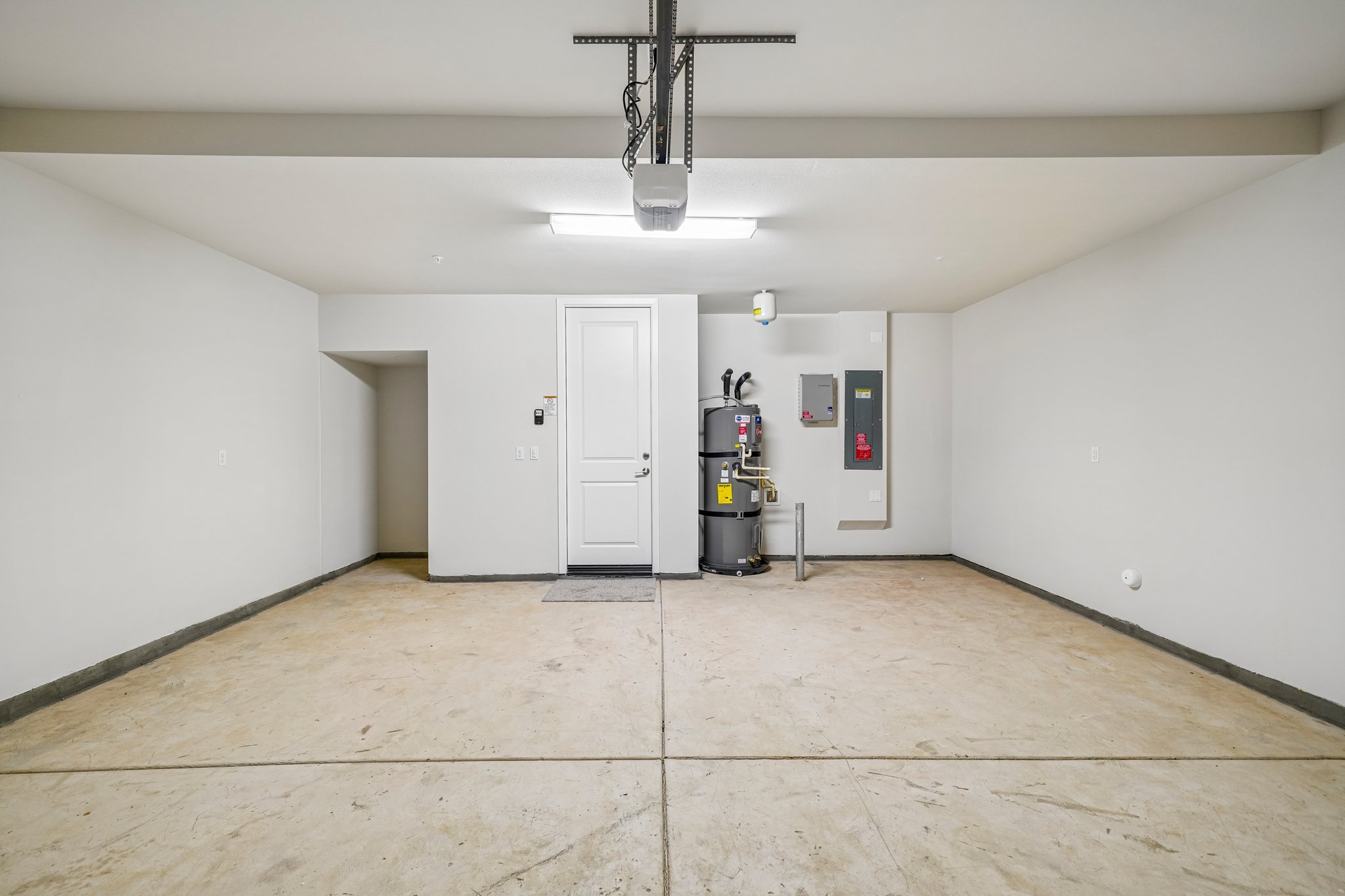 A room with white walls and a white door.