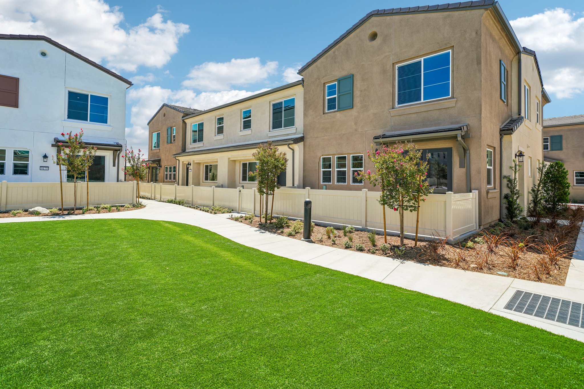 A building with a lawn in front.