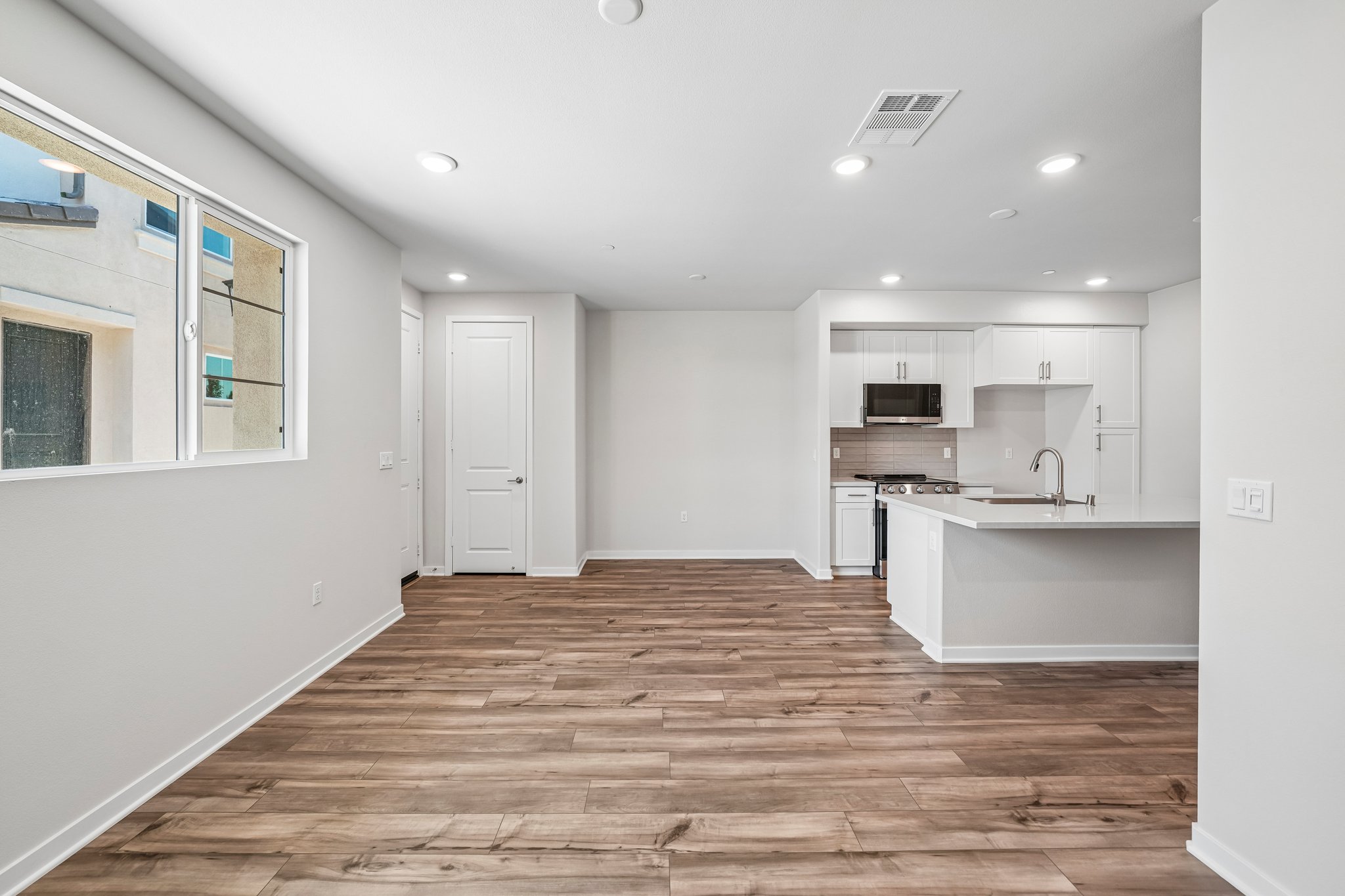 A kitchen with white walls.