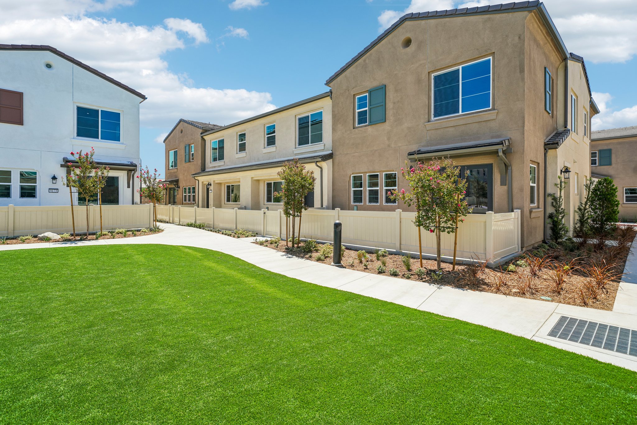 A building with a lawn in front.