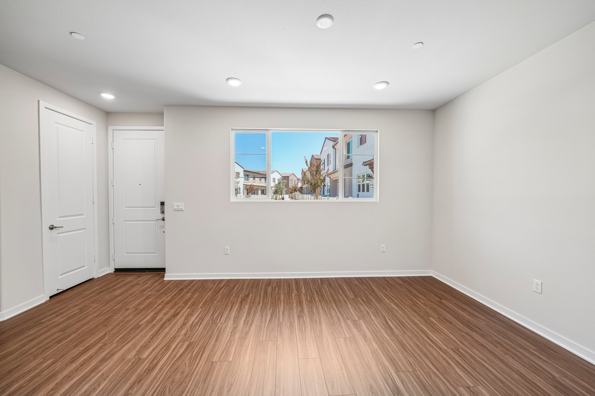 A room with a large painting on the wall.