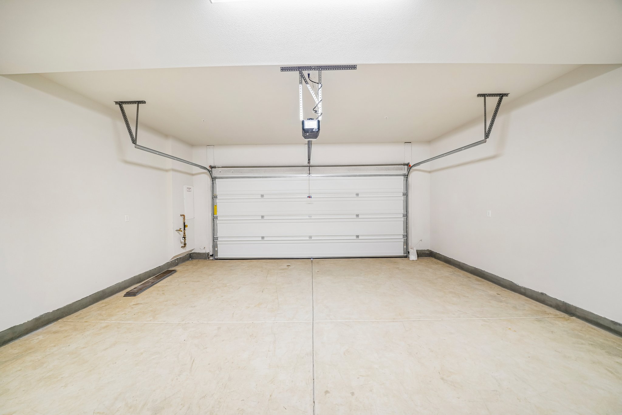 A white room with a white door.