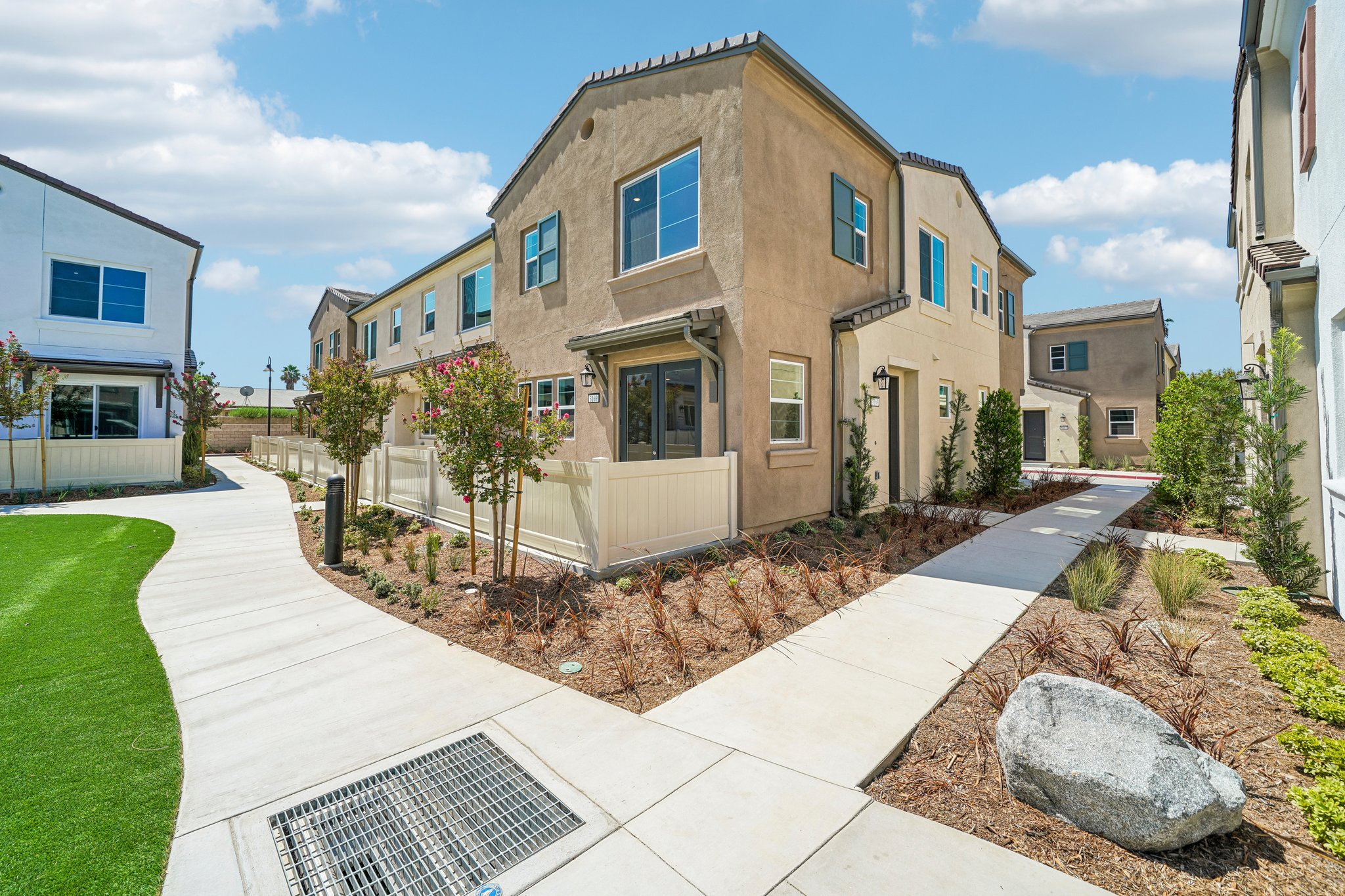 A building with a stone walkway.