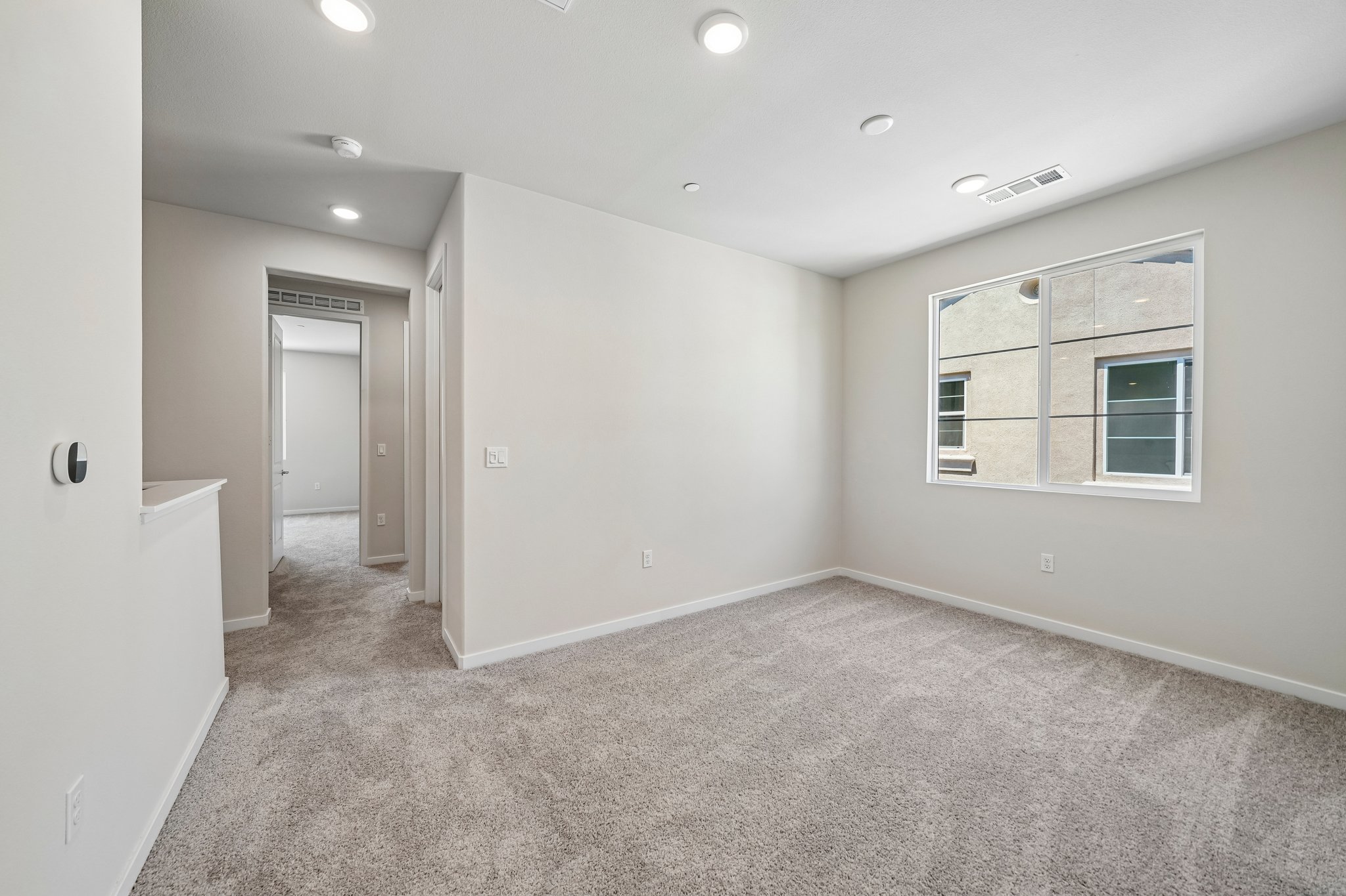 A room with a door and a window.