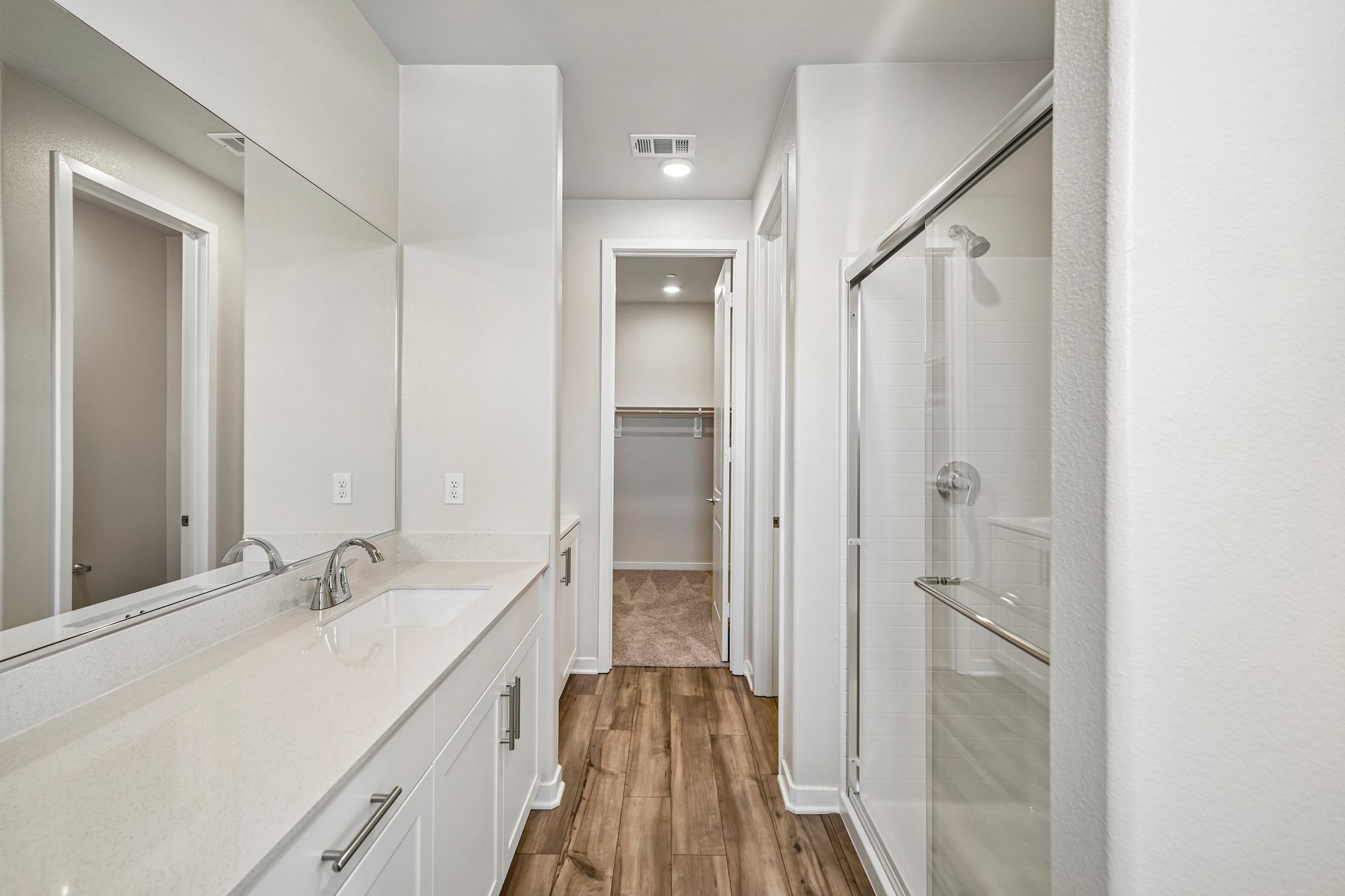 A bathroom with a glass shower.