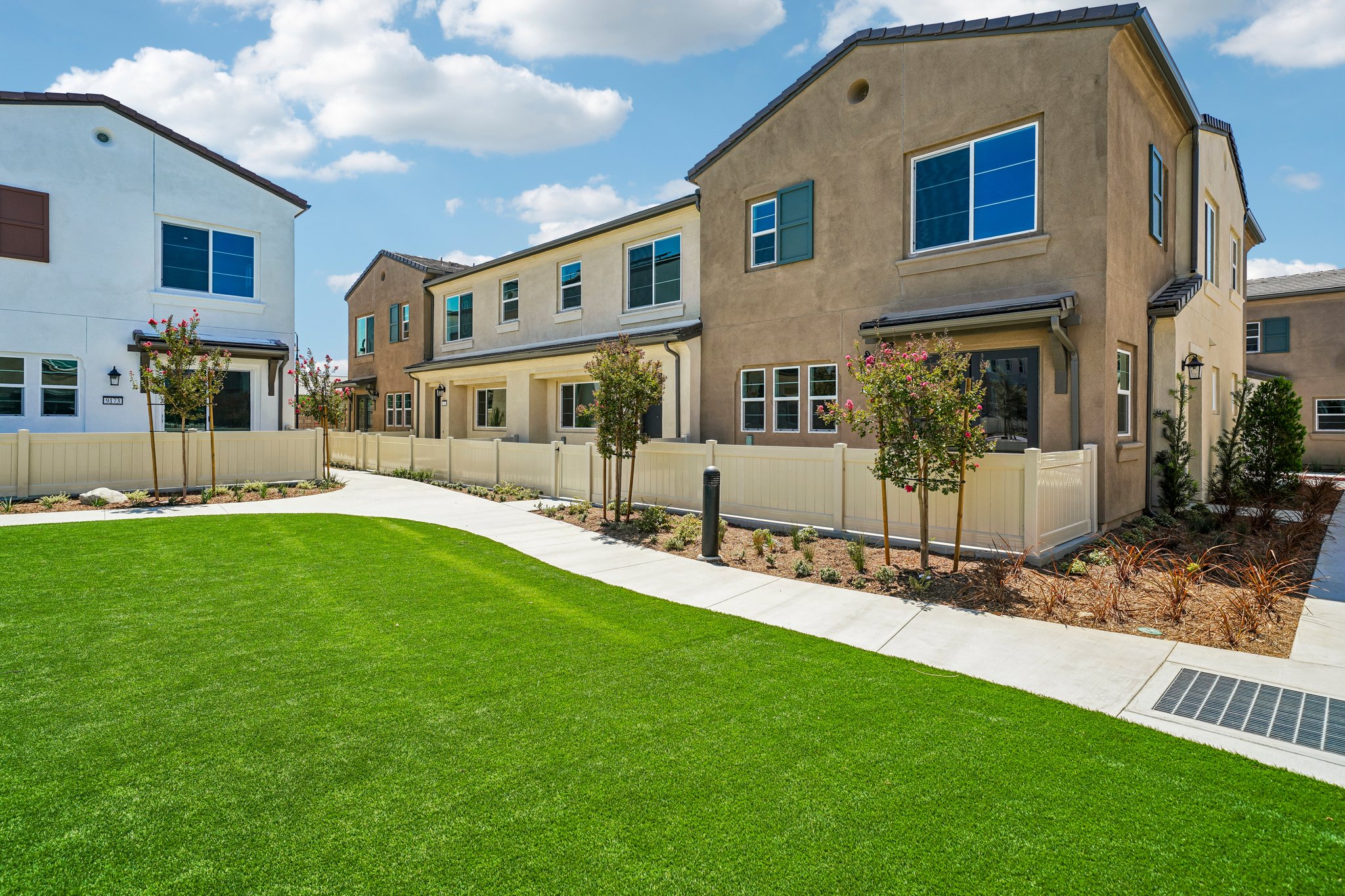 A large building with a lawn in front of it.